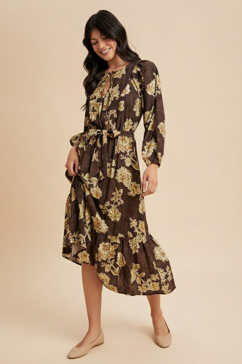 Woman wearing a floral dress with long sleeves on a beige background